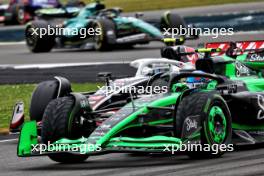 Zhou Guanyu (CHN) Sauber C44 and Nico Hulkenberg (GER) Haas VF-24 battle for position. 07.07.2024. Formula 1 World Championship, Rd 12, British Grand Prix, Silverstone, England, Race Day.