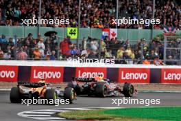 Max Verstappen (NLD) Red Bull Racing RB20 leads Lando Norris (GBR) McLaren MCL38. 07.07.2024. Formula 1 World Championship, Rd 12, British Grand Prix, Silverstone, England, Race Day.