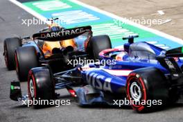 Lando Norris (GBR) McLaren MCL38 and Daniel Ricciardo (AUS) RB VCARB 01. 06.07.2024. Formula 1 World Championship, Rd 12, British Grand Prix, Silverstone, England, Qualifying Day.