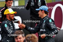 (L to R): Second placed Lewis Hamilton (GBR) Mercedes AMG F1 celebrates with team mate and pole sitter George Russell (GBR) Mercedes AMG F1 in qualifying parc ferme. 06.07.2024. Formula 1 World Championship, Rd 12, British Grand Prix, Silverstone, England, Qualifying Day.