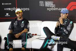 (L to R): Lewis Hamilton (GBR) Mercedes AMG F1 and George Russell (GBR) Mercedes AMG F1 in the post qualifying FIA Press Conference. 06.07.2024. Formula 1 World Championship, Rd 12, British Grand Prix, Silverstone, England, Qualifying Day.