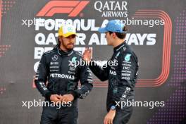 (L to R): Second placed Lewis Hamilton (GBR) Mercedes AMG F1 with team mate and pole sitter George Russell (GBR) Mercedes AMG F1 in qualifying parc ferme. 06.07.2024. Formula 1 World Championship, Rd 12, British Grand Prix, Silverstone, England, Qualifying Day.