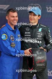 George Russell (GBR) Mercedes AMG F1 (Right) receives the Pirelli Pole Position Award from Marcus Wandt (SWE) European Space Agency. 06.07.2024. Formula 1 World Championship, Rd 12, British Grand Prix, Silverstone, England, Qualifying Day.