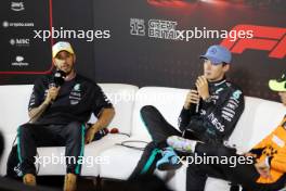 (L to R): Lewis Hamilton (GBR) Mercedes AMG F1 and George Russell (GBR) Mercedes AMG F1 in the post qualifying FIA Press Conference. 06.07.2024. Formula 1 World Championship, Rd 12, British Grand Prix, Silverstone, England, Qualifying Day.