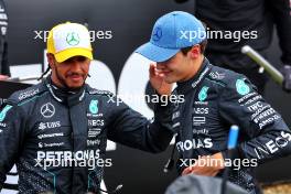 George Russell (GBR) Mercedes AMG F1 celebrates his pole position in qualifying parc ferme with second placed team mate Lewis Hamilton (GBR) Mercedes AMG F1. 06.07.2024. Formula 1 World Championship, Rd 12, British Grand Prix, Silverstone, England, Qualifying Day.