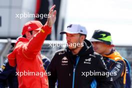 (L to R): Carlos Sainz Jr (ESP) Ferrari with Pierre Gasly (FRA) Alpine F1 Team on the drivers' parade. 07.07.2024. Formula 1 World Championship, Rd 12, British Grand Prix, Silverstone, England, Race Day.