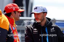 (L to R): Carlos Sainz Jr (ESP) Ferrari with Pierre Gasly (FRA) Alpine F1 Team on the drivers' parade. 07.07.2024. Formula 1 World Championship, Rd 12, British Grand Prix, Silverstone, England, Race Day.
