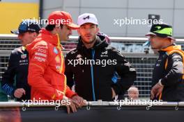 (L to R): Carlos Sainz Jr (ESP) Ferrari and Pierre Gasly (FRA) Alpine F1 Team on the drivers' parade. 07.07.2024. Formula 1 World Championship, Rd 12, British Grand Prix, Silverstone, England, Race Day.