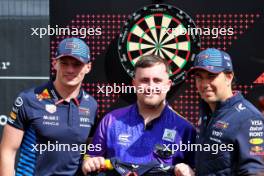 (L to R): Max Verstappen (NLD) Red Bull Racing with Luke Littler (GBR) Darts Player and Sergio Perez (MEX) Red Bull Racing. 04.07.2024. Formula 1 World Championship, Rd 12, British Grand Prix, Silverstone, England, Preparation Day.