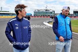 (L to R): Franco Colapinto (ARG) Williams Racing Academy Driver walks the circuit with Logan Sargeant (USA) Williams Racing. 04.07.2024. Formula 1 World Championship, Rd 12, British Grand Prix, Silverstone, England, Preparation Day.