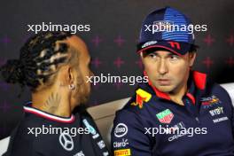 Sergio Perez (MEX) Red Bull Racing and Lewis Hamilton (GBR) Mercedes AMG F1 in the FIA Press Conference. 04.07.2024. Formula 1 World Championship, Rd 12, British Grand Prix, Silverstone, England, Preparation Day.