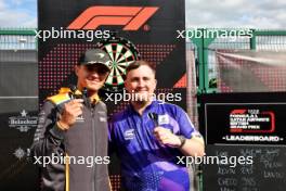 (L to R): Lando Norris (GBR) McLaren with Luke Littler (GBR) Darts Player. 04.07.2024. Formula 1 World Championship, Rd 12, British Grand Prix, Silverstone, England, Preparation Day.