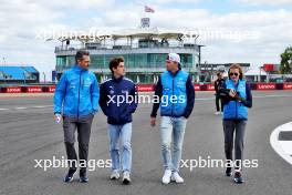 (L to R): Gaetan Jego, Williams Racing Race Engineer walks the circuit with Franco Colapinto (ARG) Williams Racing Academy Driver; Logan Sargeant (USA) Williams Racing; and Elizabeth Wood Boyer (GBR) Williams Racing Performance Engineer. 04.07.2024. Formula 1 World Championship, Rd 12, British Grand Prix, Silverstone, England, Preparation Day.