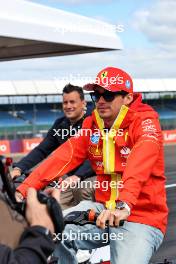 Charles Leclerc (MON) Ferrari rides the circuit with Will Buxton (GBR) F1 Digital Presenter. 04.07.2024. Formula 1 World Championship, Rd 12, British Grand Prix, Silverstone, England, Preparation Day.