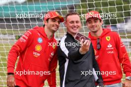 (L to R): Carlos Sainz Jr (ESP) Ferrari and Charles Leclerc (MON) Ferrari. 04.07.2024. Formula 1 World Championship, Rd 12, British Grand Prix, Silverstone, England, Preparation Day.