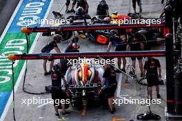 Sergio Perez (MEX) Red Bull Racing RB20 and Max Verstappen (NLD) Red Bull Racing RB20 in the pits. 19.07.2024. Formula 1 World Championship, Rd 13, Hungarian Grand Prix, Budapest, Hungary, Practice Day.