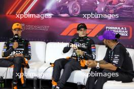 (L to R): Lando Norris (GBR) McLaren; Oscar Piastri (AUS) McLaren; and Lewis Hamilton (GBR) Mercedes AMG F1, in the post race FIA Press Conference. 21.07.2024. Formula 1 World Championship, Rd 13, Hungarian Grand Prix, Budapest, Hungary, Race Day.