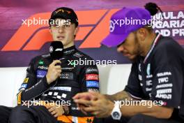 Oscar Piastri (AUS) McLaren and Lewis Hamilton (GBR) Mercedes AMG F1 in the post race FIA Press Conference. 21.07.2024. Formula 1 World Championship, Rd 13, Hungarian Grand Prix, Budapest, Hungary, Race Day.