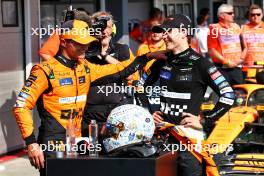 (L to R): Second placed Lando Norris (GBR) McLaren celebrates with team mate and race winner Oscar Piastri (AUS) McLaren in parc ferme. 21.07.2024. Formula 1 World Championship, Rd 13, Hungarian Grand Prix, Budapest, Hungary, Race Day.