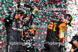 Race winner Oscar Piastri (AUS) McLaren celebrates on the podium with team mate Lando Norris (GBR) McLaren; and Lewis Hamilton (GBR) Mercedes AMG F1. 21.07.2024. Formula 1 World Championship, Rd 13, Hungarian Grand Prix, Budapest, Hungary, Race Day.
