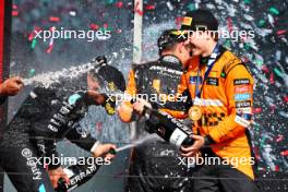 Race winner Oscar Piastri (AUS) McLaren celebrates on the podium with team mate Lando Norris (GBR) McLaren; Lewis Hamilton (GBR) Mercedes AMG F1; and Randy Singh (GBR) McLaren Strategy and Sporting Director. 21.07.2024. Formula 1 World Championship, Rd 13, Hungarian Grand Prix, Budapest, Hungary, Race Day.