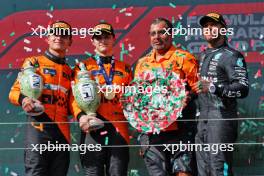 The podium (L to R): Lando Norris (GBR) McLaren, second; Oscar Piastri (AUS) McLaren, race winner; Randy Singh (GBR) McLaren Strategy and Sporting Director; Lewis Hamilton (GBR) Mercedes AMG F1, third. 21.07.2024. Formula 1 World Championship, Rd 13, Hungarian Grand Prix, Budapest, Hungary, Race Day.