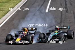 Lewis Hamilton (GBR) Mercedes AMG F1 W15 and Max Verstappen (NLD) Red Bull Racing RB20 collide. 21.07.2024. Formula 1 World Championship, Rd 13, Hungarian Grand Prix, Budapest, Hungary, Race Day.