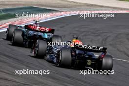 Lewis Hamilton (GBR) Mercedes AMG F1 W15 leads Max Verstappen (NLD) Red Bull Racing RB20. 21.07.2024. Formula 1 World Championship, Rd 13, Hungarian Grand Prix, Budapest, Hungary, Race Day.