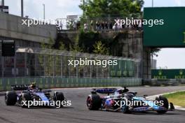 Esteban Ocon (FRA) Alpine F1 Team A524 and Logan Sargeant (USA) Williams Racing FW46. 21.07.2024. Formula 1 World Championship, Rd 13, Hungarian Grand Prix, Budapest, Hungary, Race Day.