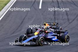 Logan Sargeant (USA) Williams Racing FW46 and Sergio Perez (MEX) Red Bull Racing RB20 battle for position. 21.07.2024. Formula 1 World Championship, Rd 13, Hungarian Grand Prix, Budapest, Hungary, Race Day.