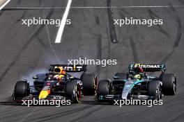 Max Verstappen (NLD) Red Bull Racing RB20 and Lewis Hamilton (GBR) Mercedes AMG F1 W15 collide. 21.07.2024. Formula 1 World Championship, Rd 13, Hungarian Grand Prix, Budapest, Hungary, Race Day.