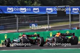 Lewis Hamilton (GBR) Mercedes AMG F1 W15 and Max Verstappen (NLD) Red Bull Racing RB20 battle for position. 21.07.2024. Formula 1 World Championship, Rd 13, Hungarian Grand Prix, Budapest, Hungary, Race Day.