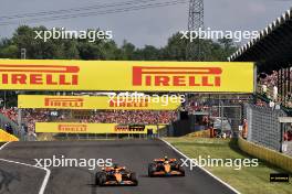 Lando Norris (GBR) McLaren MCL38 allows Oscar Piastri (AUS) McLaren MCL38 to pass and retake the lead of the race. 21.07.2024. Formula 1 World Championship, Rd 13, Hungarian Grand Prix, Budapest, Hungary, Race Day.