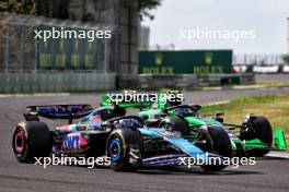 Pierre Gasly (FRA) Alpine F1 Team A524 and Zhou Guanyu (CHN) Sauber C44 battle for position. 21.07.2024. Formula 1 World Championship, Rd 13, Hungarian Grand Prix, Budapest, Hungary, Race Day.