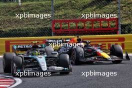 Lewis Hamilton (GBR) Mercedes AMG F1 W15 and Max Verstappen (NLD) Red Bull Racing RB20 battle for position. 21.07.2024. Formula 1 World Championship, Rd 13, Hungarian Grand Prix, Budapest, Hungary, Race Day.