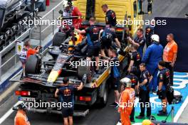 The Red Bull Racing RB20 of Sergio Perez (MEX) Red Bull Racing is recovered back to the pits on the back of a truck after he crashed in qualifying. 20.07.2024. Formula 1 World Championship, Rd 13, Hungarian Grand Prix, Budapest, Hungary, Qualifying Day.