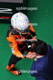Lando Norris (GBR) McLaren celebrates his pole position with Mohammed Bin Sulayem (UAE) FIA President in qualifying parc ferme. 20.07.2024. Formula 1 World Championship, Rd 13, Hungarian Grand Prix, Budapest, Hungary, Qualifying Day.