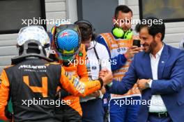 (L to R): Lando Norris (GBR) McLaren celebrates his pole position in qualifying parc ferme with second placed team mate Oscar Piastri (AUS) McLaren and Mohammed Bin Sulayem (UAE) FIA President. 20.07.2024. Formula 1 World Championship, Rd 13, Hungarian Grand Prix, Budapest, Hungary, Qualifying Day.