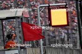 Marshal waves a red flag as the qualifying session is stopped. 20.07.2024. Formula 1 World Championship, Rd 13, Hungarian Grand Prix, Budapest, Hungary, Qualifying Day.