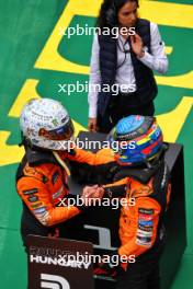 (L to R): Lando Norris (GBR) McLaren celebrates his pole position in qualifying parc ferme with second placed team mate Oscar Piastri (AUS) McLaren. 20.07.2024. Formula 1 World Championship, Rd 13, Hungarian Grand Prix, Budapest, Hungary, Qualifying Day.