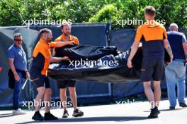 McLaren mechanics with a delivery in the paddock. 17.05.2024. Formula 1 World Championship, Rd 7, Emilia Romagna Grand Prix, Imola, Italy, Practice Day.