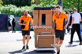 McLaren mechanics with a delivery in the paddock. 17.05.2024. Formula 1 World Championship, Rd 7, Emilia Romagna Grand Prix, Imola, Italy, Practice Day.