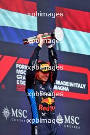 Race winner Max Verstappen (NLD) Red Bull Racing celebrates on the podium. 19.05.2024. Formula 1 World Championship, Rd 7, Emilia Romagna Grand Prix, Imola, Italy, Race Day.