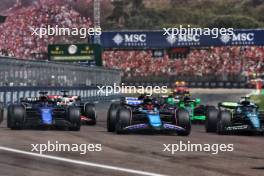 (L to R): Alexander Albon (THA) Williams Racing FW46 and Esteban Ocon (FRA) Alpine F1 Team A524 at the start of the race. 19.05.2024. Formula 1 World Championship, Rd 7, Emilia Romagna Grand Prix, Imola, Italy, Race Day.