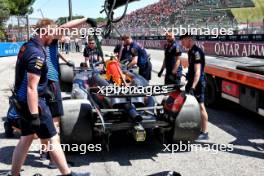 The Red Bull Racing RB20 of Sergio Perez (MEX) is recovered back to the pits after he crashed in the third practice session. 18.05.2024. Formula 1 World Championship, Rd 7, Emilia Romagna Grand Prix, Imola, Italy, Qualifying Day.