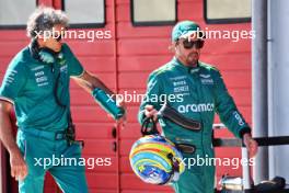 Fernando Alonso (ESP) Aston Martin F1 Team with Edoardo Bendinelli (ITA) Aston Martin F1 Team Personal Trainer. 18.05.2024. Formula 1 World Championship, Rd 7, Emilia Romagna Grand Prix, Imola, Italy, Qualifying Day.