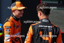 (L to R): Oscar Piastri (AUS) McLaren with team mate Lando Norris (GBR) McLaren in qualifying parc ferme. 18.05.2024. Formula 1 World Championship, Rd 7, Emilia Romagna Grand Prix, Imola, Italy, Qualifying Day.