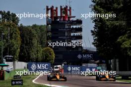 (L to R): Oscar Piastri (AUS) McLaren MCL38 and team mate Lando Norris (GBR) McLaren MCL38. 18.05.2024. Formula 1 World Championship, Rd 7, Emilia Romagna Grand Prix, Imola, Italy, Qualifying Day.