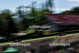 Max Verstappen (NLD) Red Bull Racing RB20 leads Charles Leclerc (MON) Ferrari SF-24. 18.05.2024. Formula 1 World Championship, Rd 7, Emilia Romagna Grand Prix, Imola, Italy, Qualifying Day.