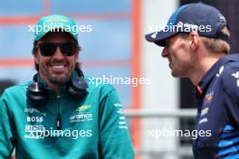 (L to R): Fernando Alonso (ESP) Aston Martin F1 Team and Max Verstappen (NLD) Red Bull Racing on the drivers' parade. 19.05.2024. Formula 1 World Championship, Rd 7, Emilia Romagna Grand Prix, Imola, Italy, Race Day.